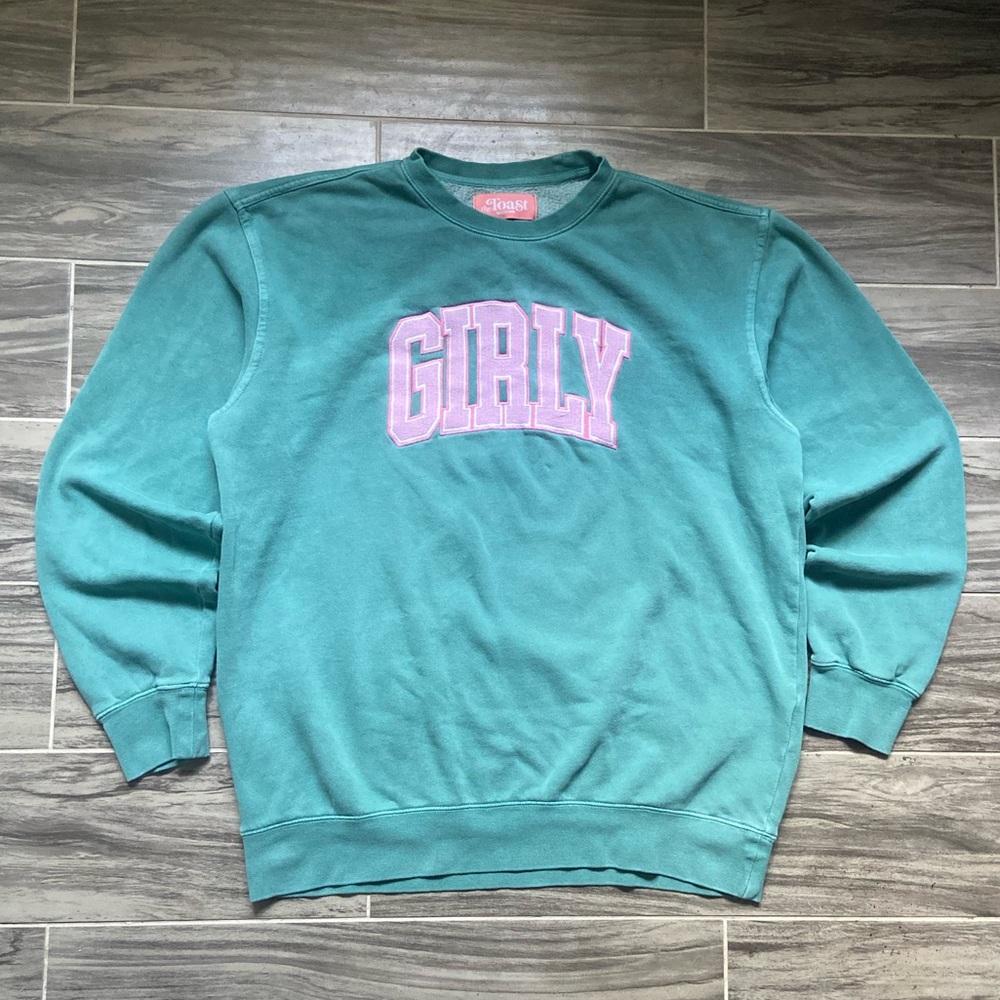 The Toast “girly” podcast merch women’s teal sweatshirt